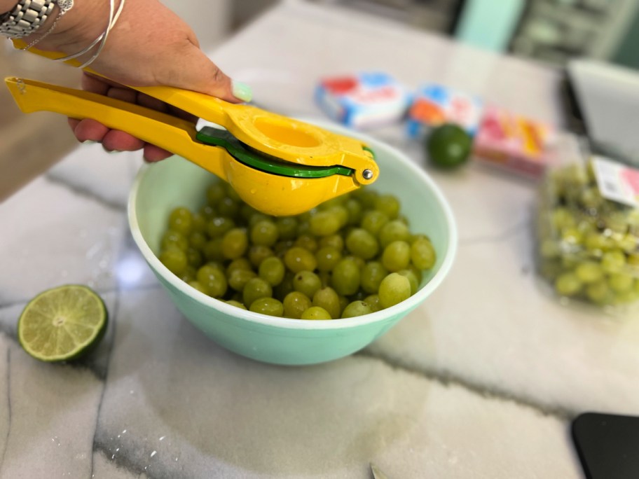 squeezing lime juice on grapes