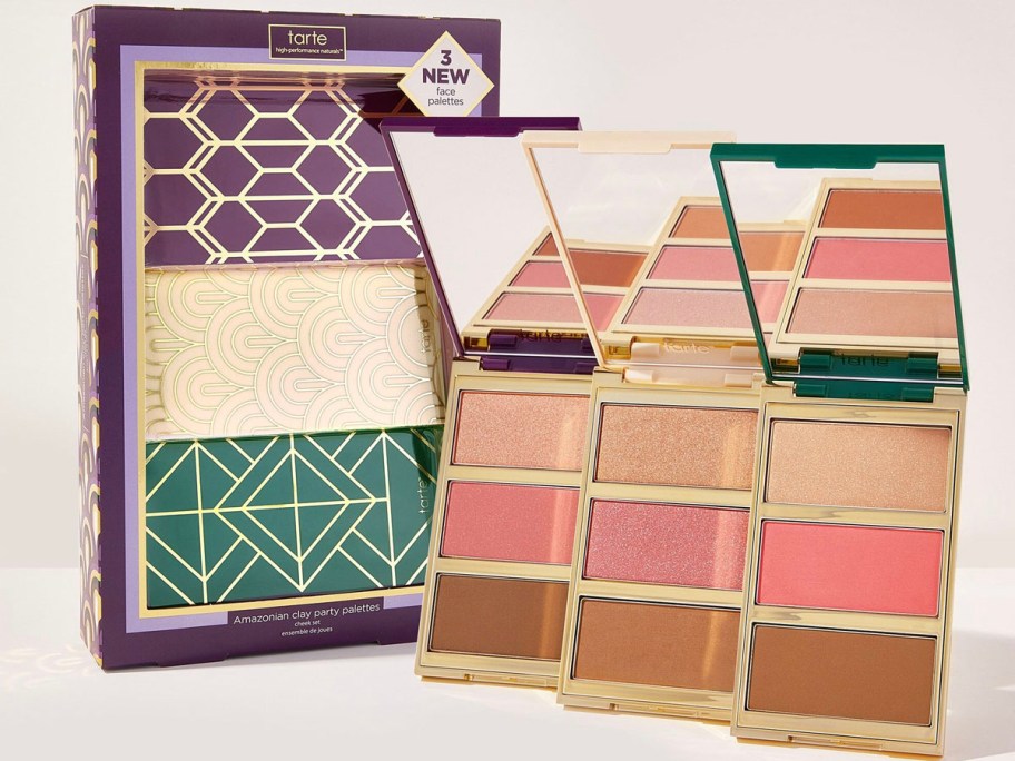 three tarte clay palettes next to box