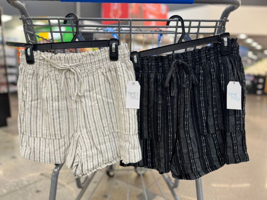 two pair of time and tru womens linen shorts hanging on a clothing rack in a walmart store