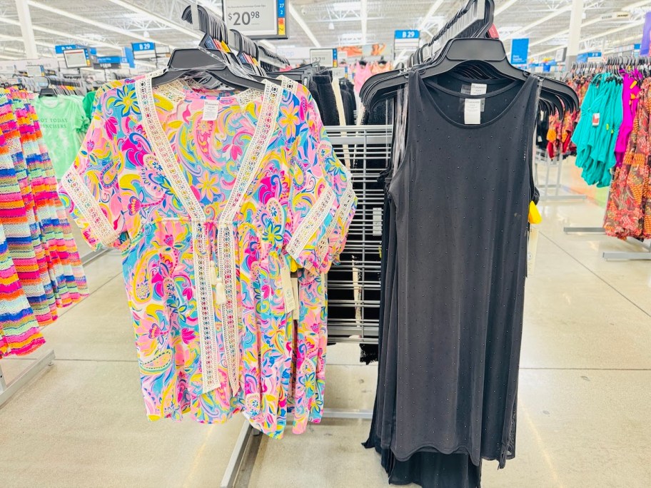 paisley and black swim suit coverups hanging in store