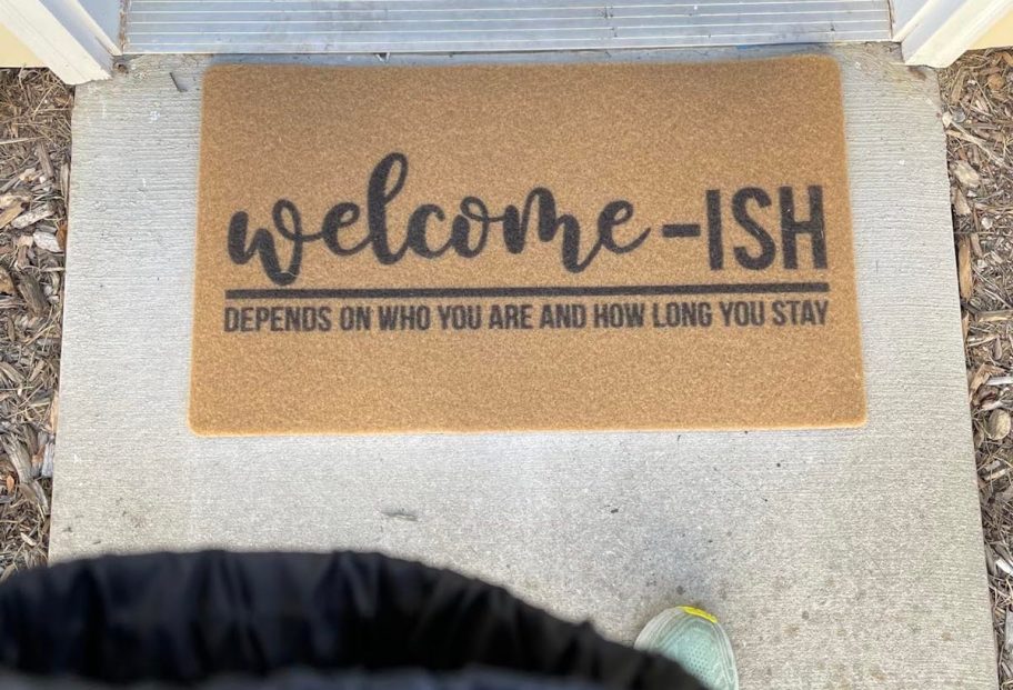 welcome-ish doormat on concrete