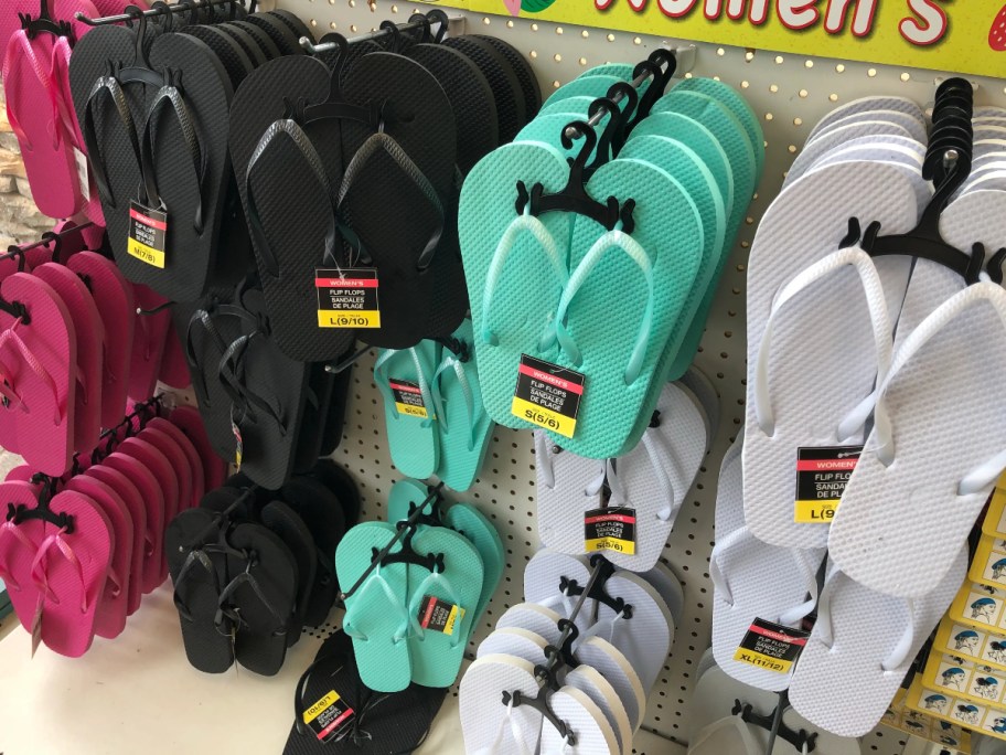 women's flip flops hanging at Dollar Tree