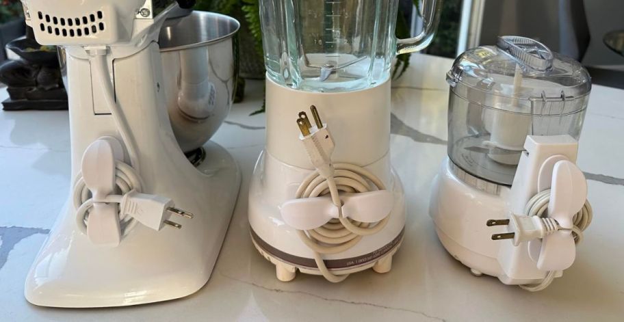 3 appliances with chord organizers attached to them