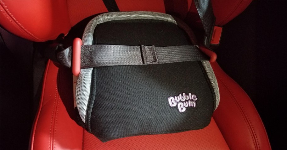 Bubble Bum Inflatable Booster Car Seat sitting in a red vehicle seat