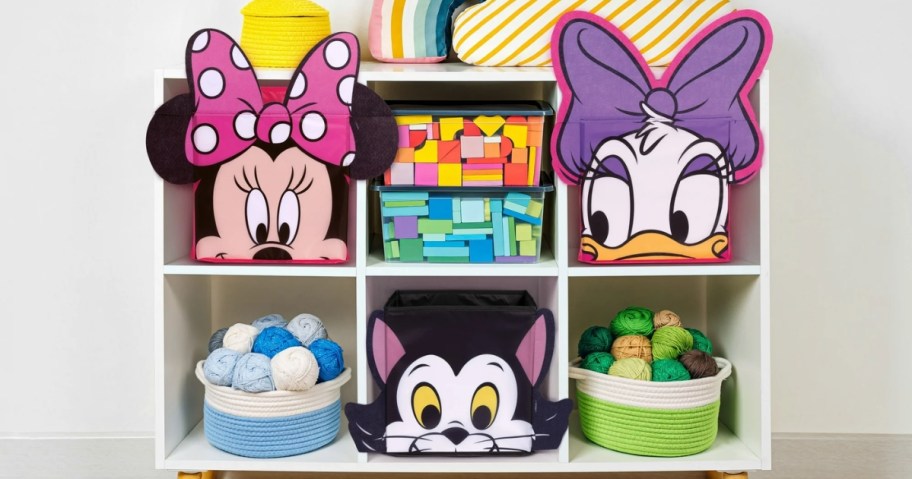 cube bookcase with kids toys and Minnie, Daisy and Figaro Disney character storage bins