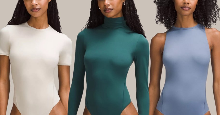 women wearing solid color bodysuits in different styles, off white short sleeve, teal green long-sleeve turleneck, and light blue sleeveless