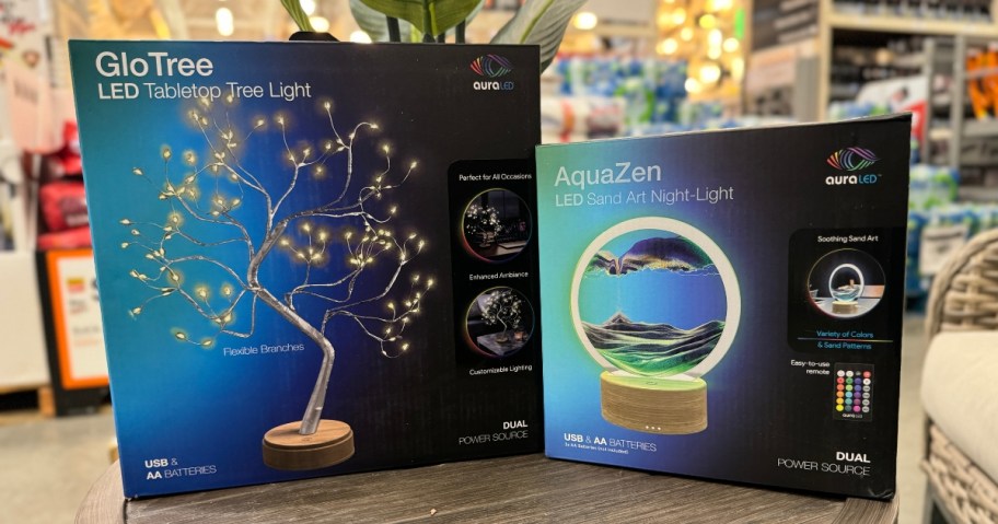 boxes with Tzumi Tree and Sand Art Lights in store