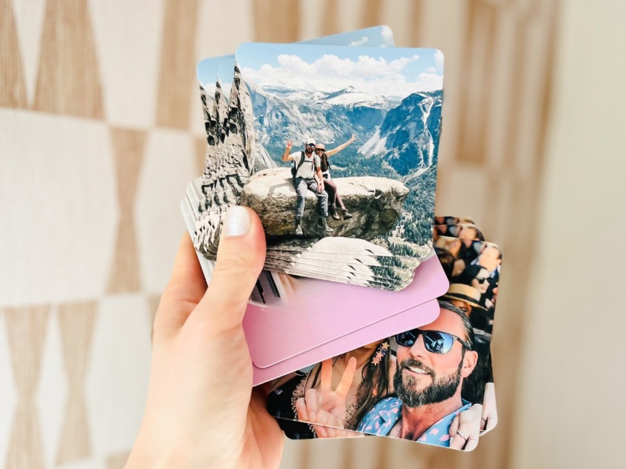 woman's hand holding custom photo coasters