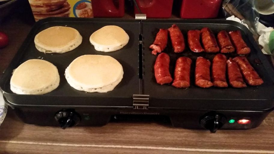 a 3 in 1 griddle on a on a counter top with pancakes and sausage cooking