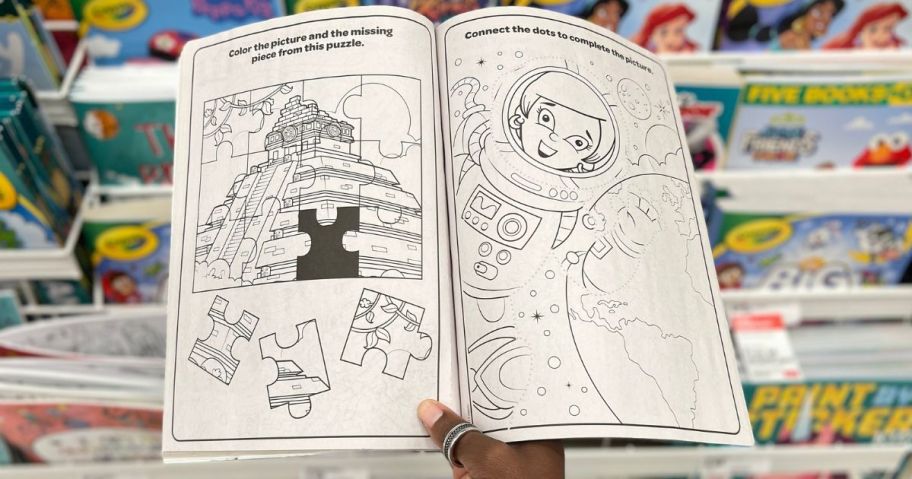 hand holding a coloring book