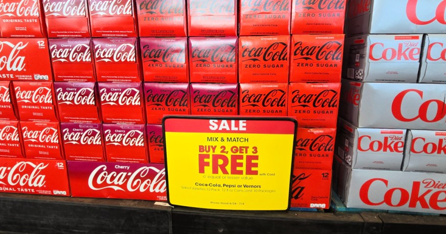 stack of coke 12 packs at kroger store