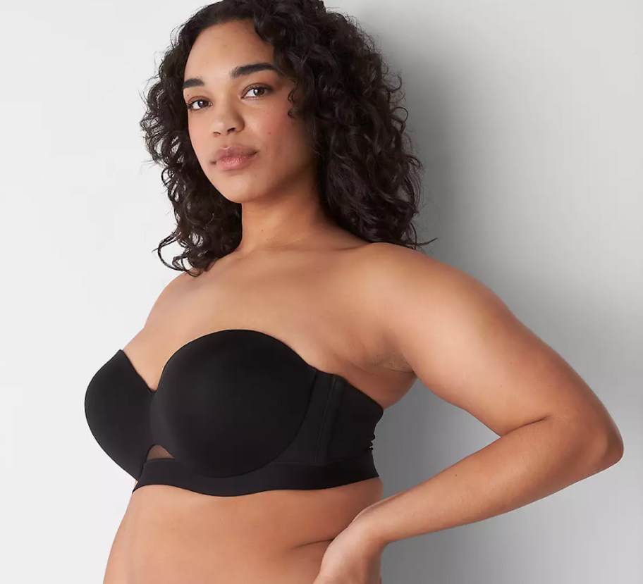 woman posing in black strapless bra