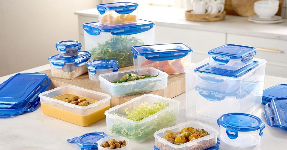 LocknLock 16-Piece plastic Storage Set with blue lids, shown on a kitchen island with food in the containers