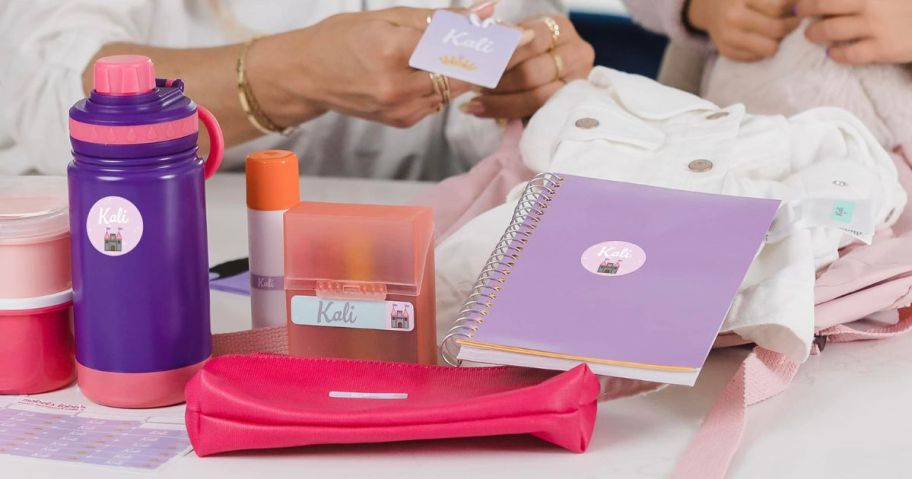 Mom and daughter putting Mabel's Labels on school essentials