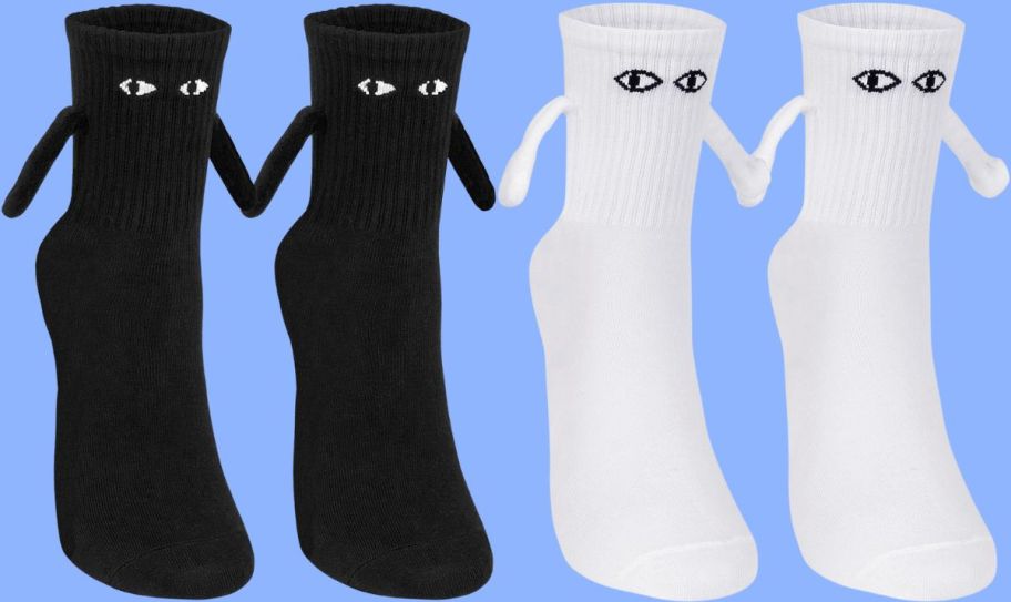 pairs of black and white magnetic hand holding novelty socks