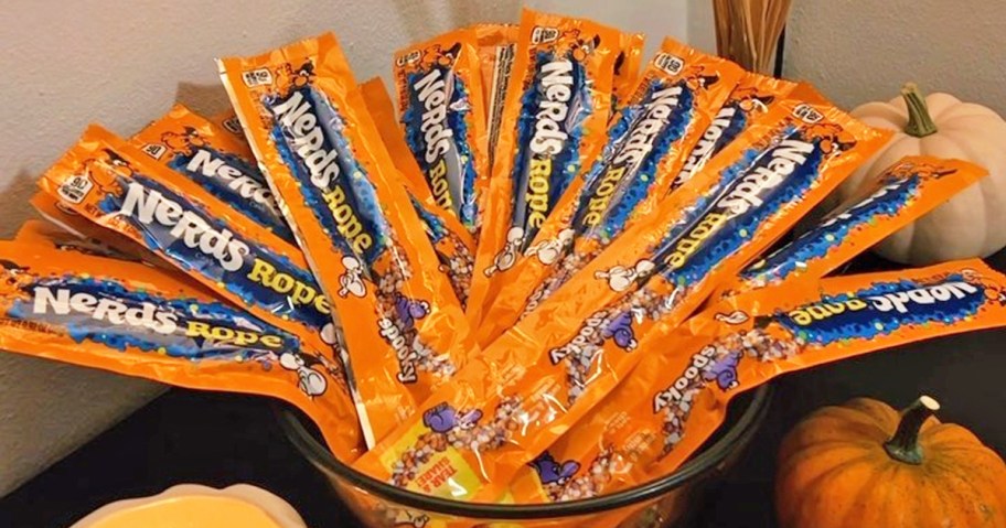 bowl full of orange packs of Nerds Spooky Ropes