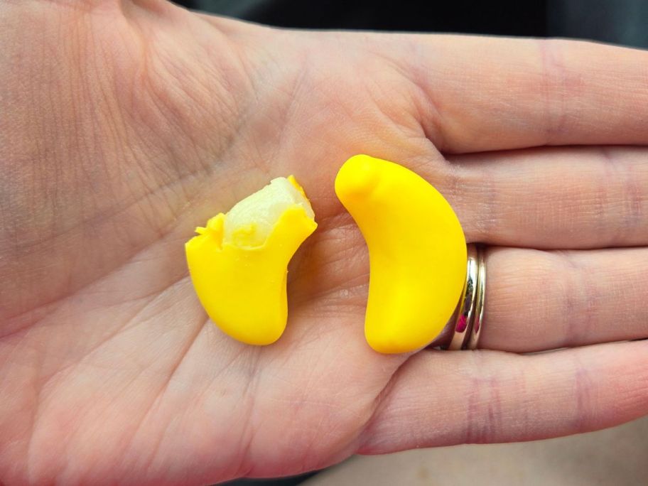 Hand holding Nice! Peelable Banana Candy