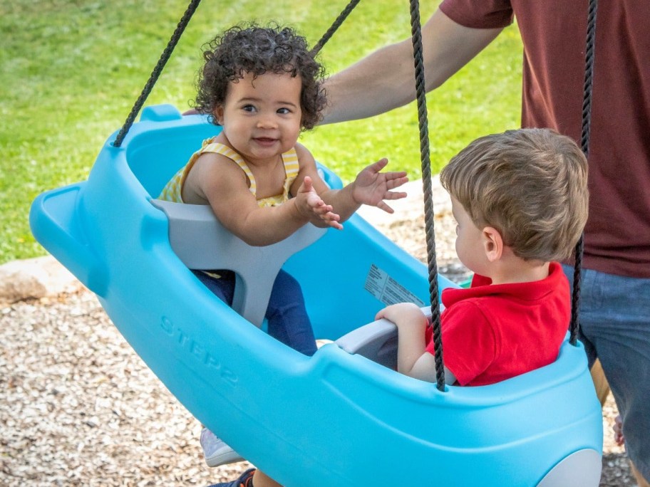 2 toddlers in a Step2 Signature Rocket Swing