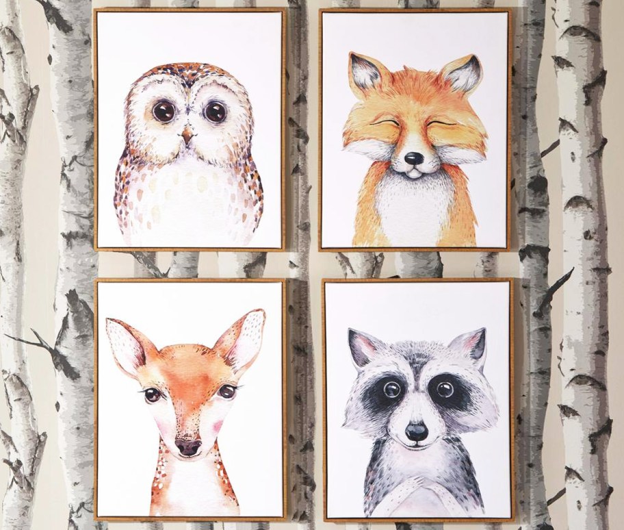 4 framed pieces of animal wall art in kids room