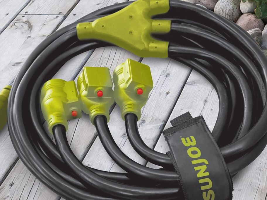 A sun Joe Generator Extension Cord o a deck