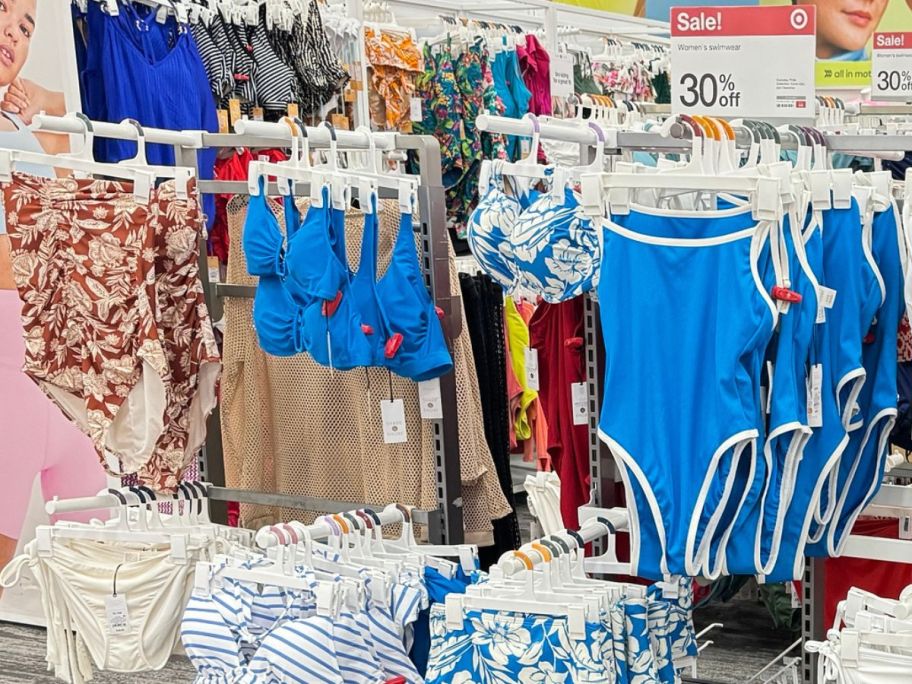 racks of swimwear at Target including 1-piece options