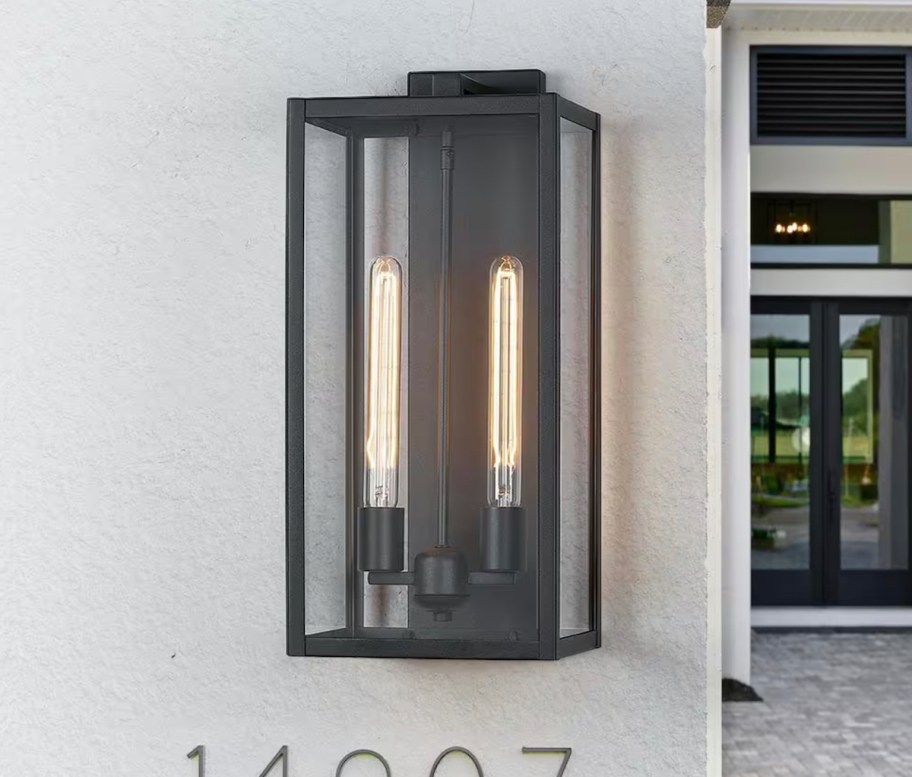 black sconce on front porch doorway