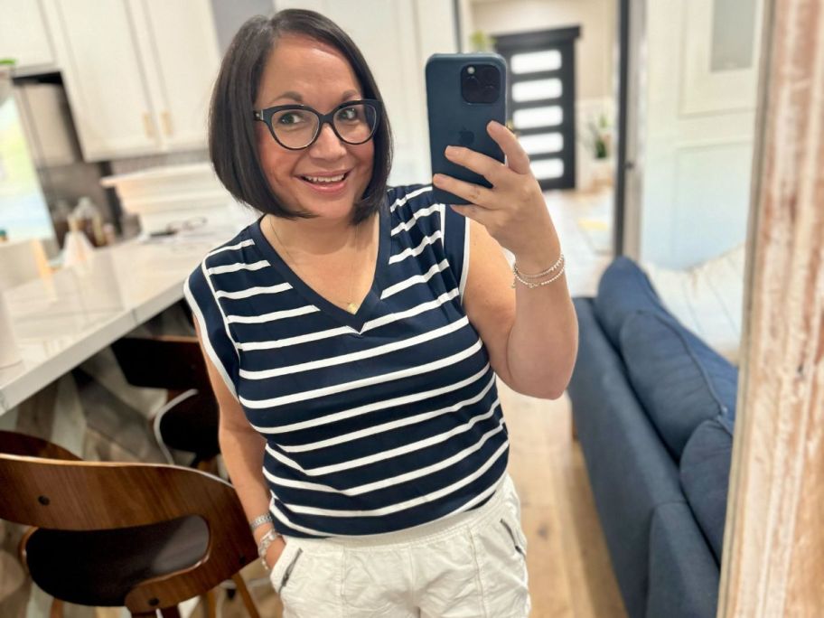 woman wearing Wiholl Women's Cap-Sleeve V-Neck Top and taking selfie