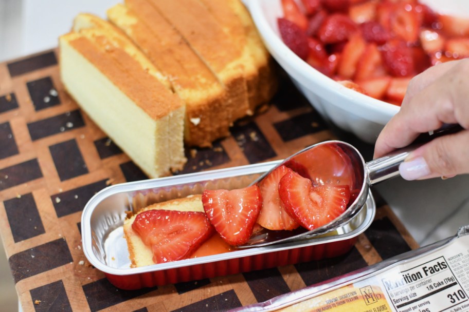 adding strawberries to pound cake