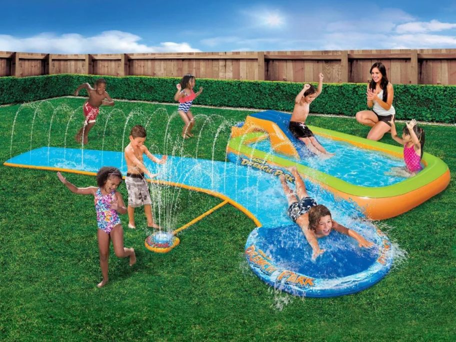kids playing on Banzai 13.75' Aqua Drench 3-in-1 Splash Park on yard
