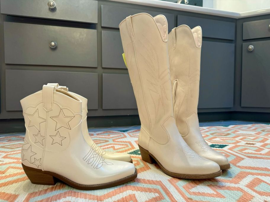 short and tall cream colored boots on floor in bathroom