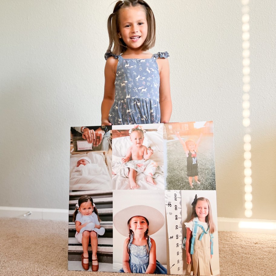 little girl holding large picture collage of self