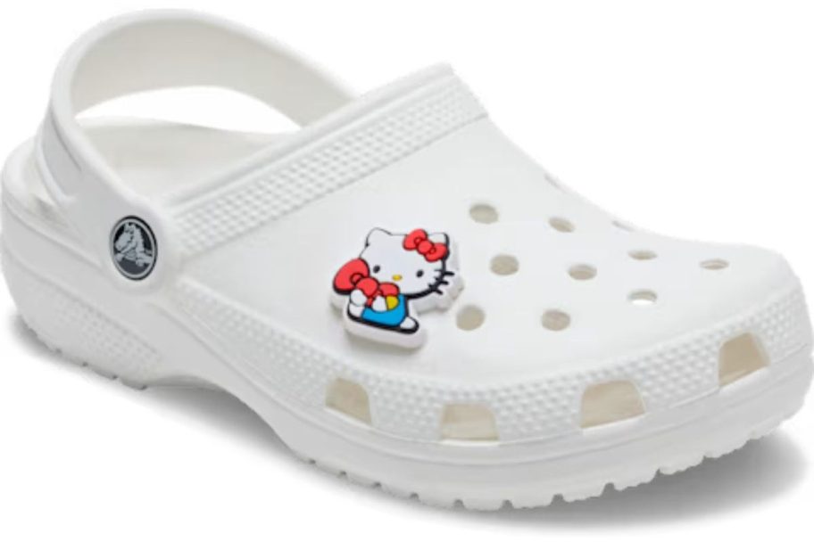 Sitting Hello Kitty Jibbitz Charm on white crocs
