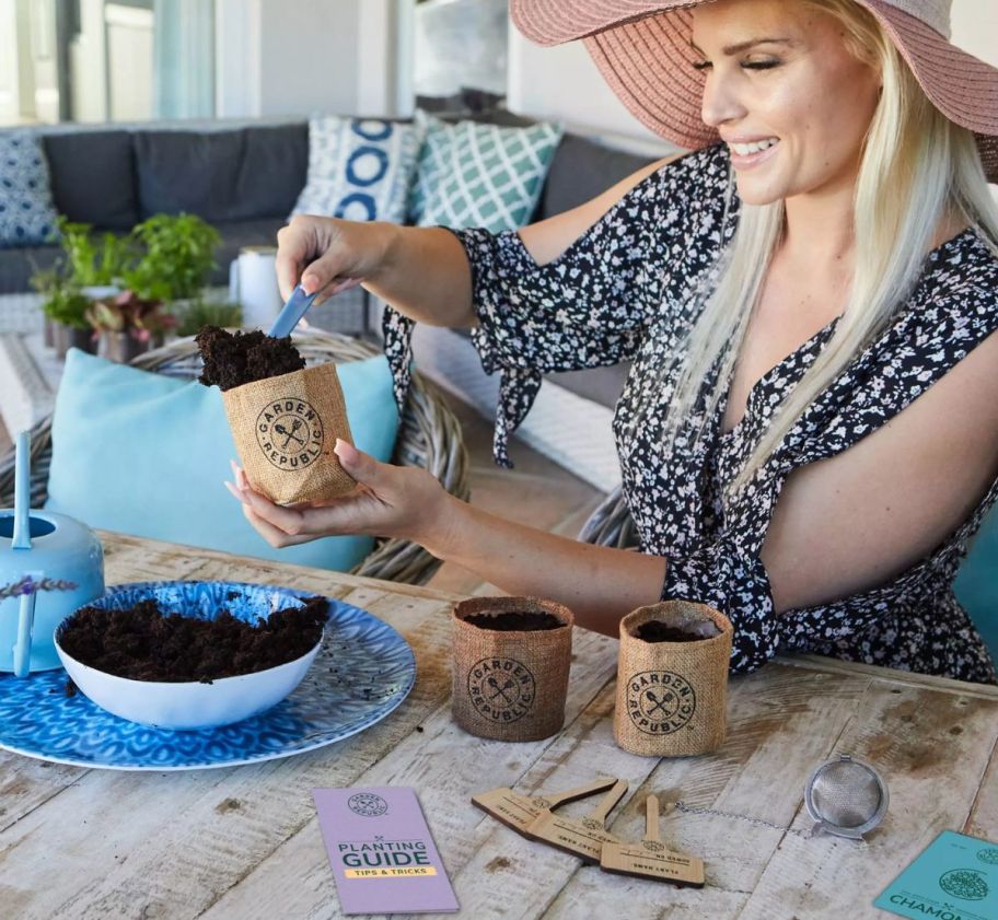 a woman planting starter seeds