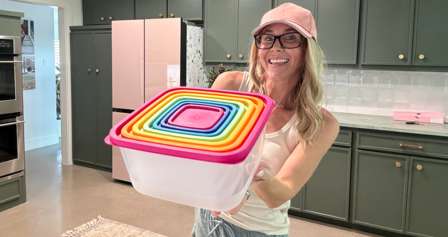 Collin holding Walmart mainstays food storage set 