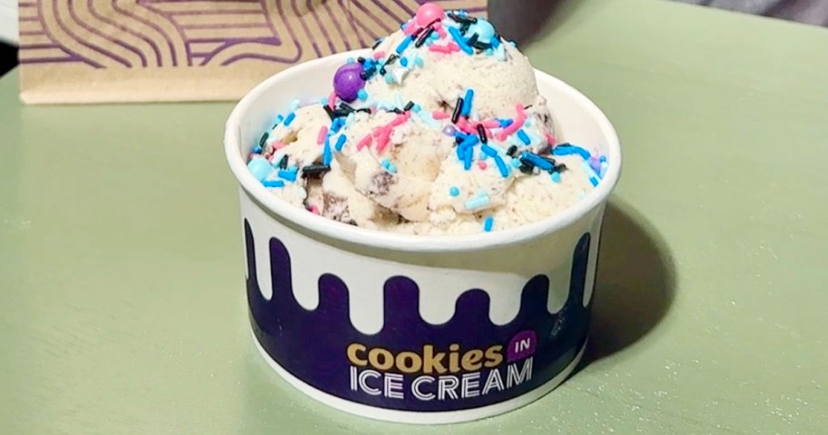 cup of insomnia cookies ice cream sitting on green table