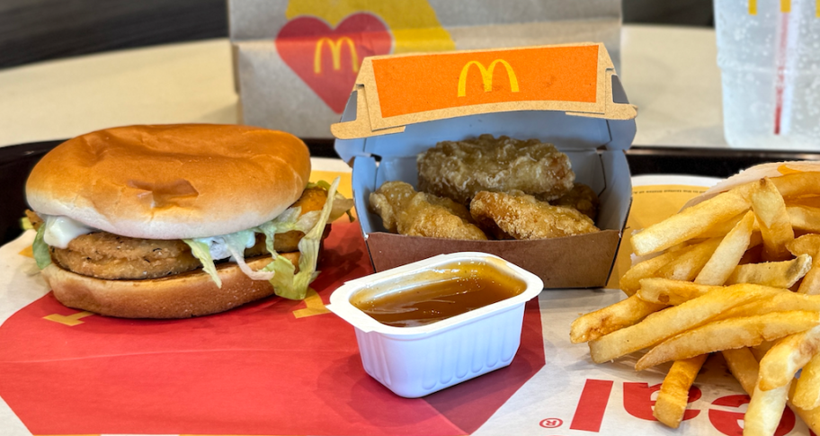 McDonald's Meal Deal on table with sandwich, fries, and chicken nuggets