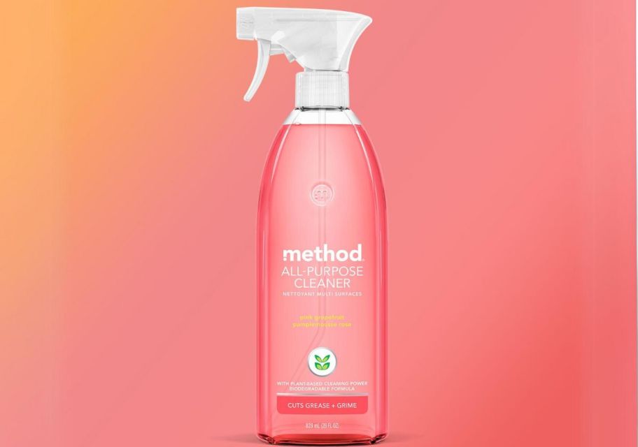 a bottle of method method all purpose spray cleaner in pink grapefruit on a pink and orange gradient background