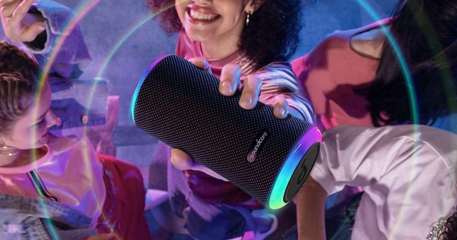 hand holding portable speaker