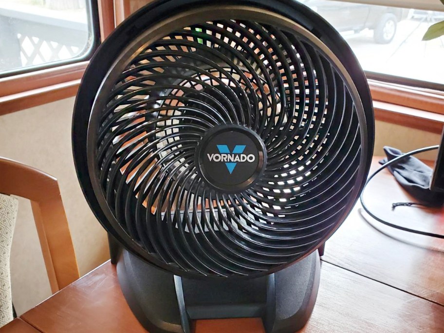 black vornado fan on table