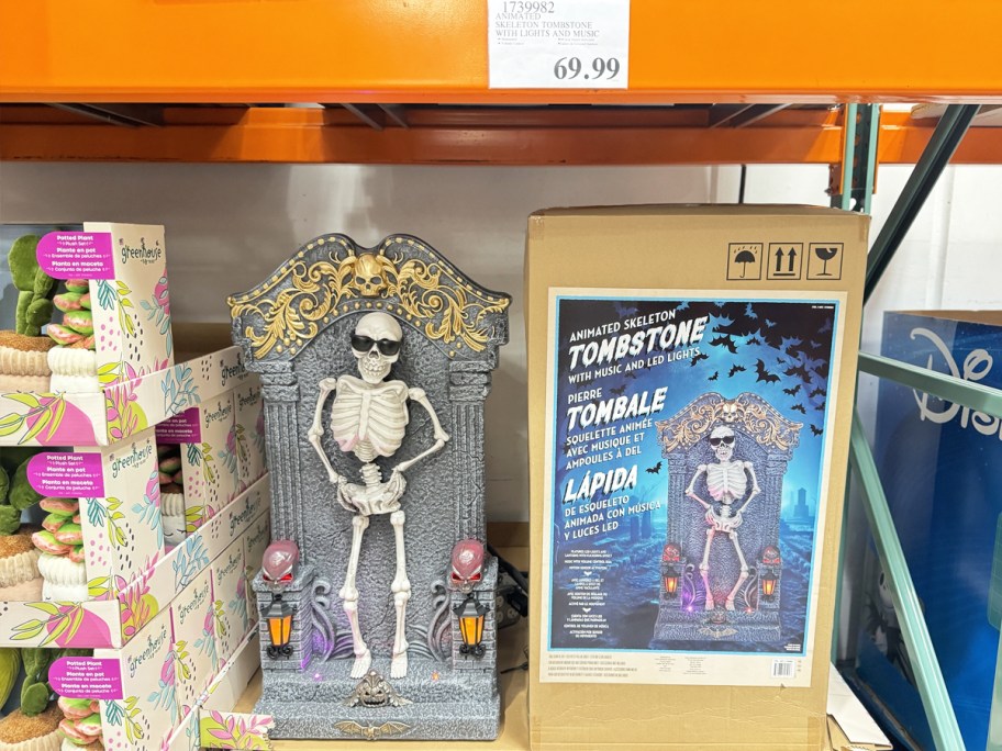 animated skeleton tombstone decoration in display in store