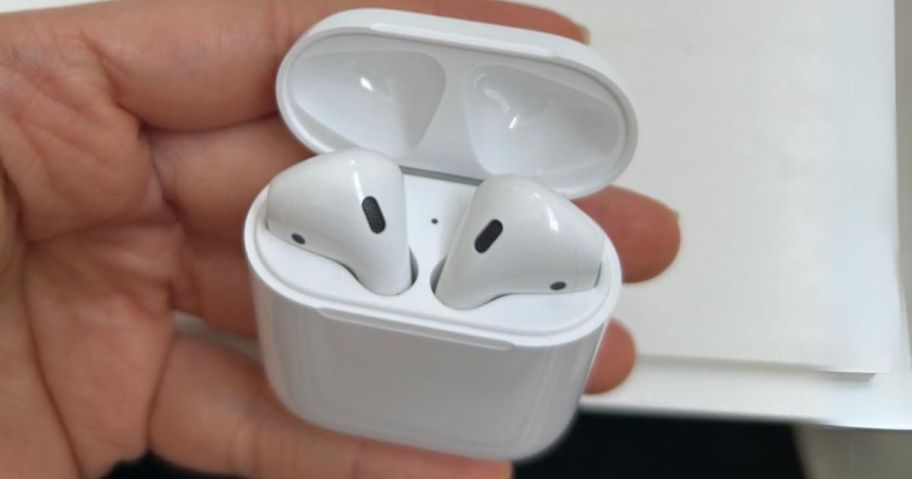 Apple AirPods Wireless 2nd Generation w/ Charging Case in hand