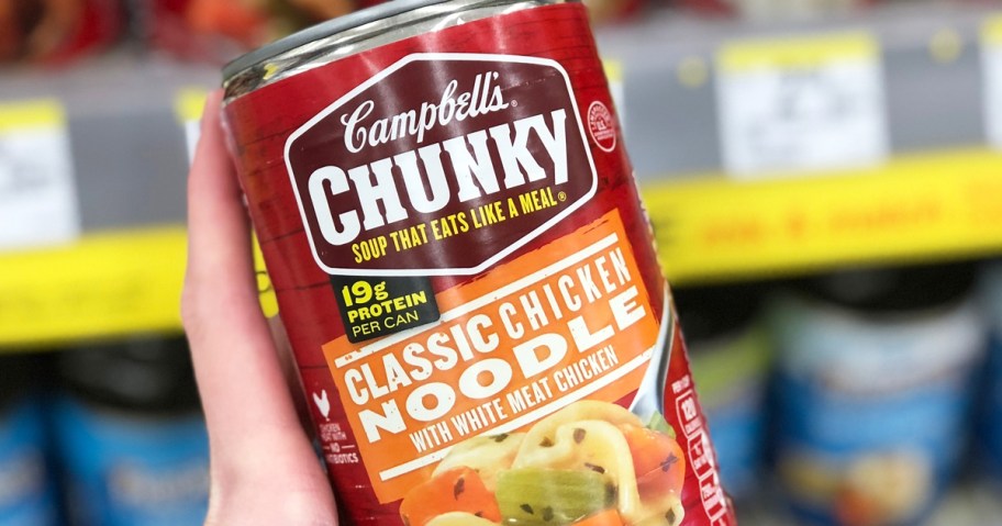 hand holding up a can of Campbell’s Chunky Classic Chicken Noodle Soup