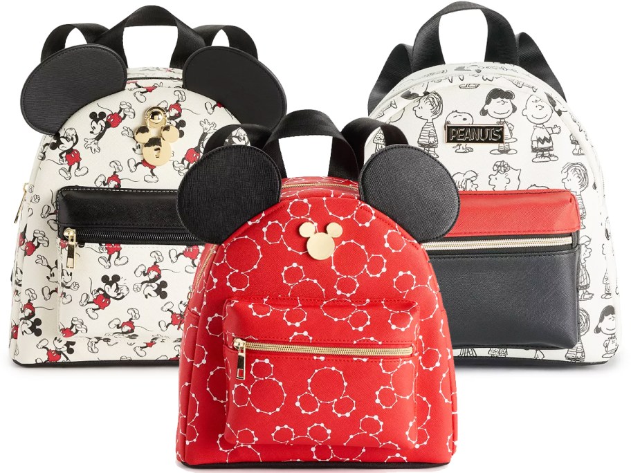 three mini backpacks in mickey mouse and peanuts characters prints