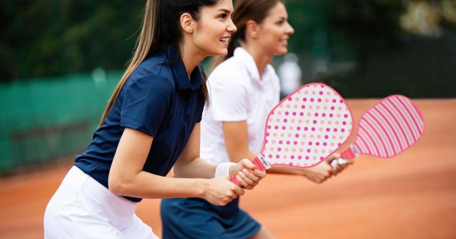 two ladies playing with Eliwdshen Wood Pickleball Set on court