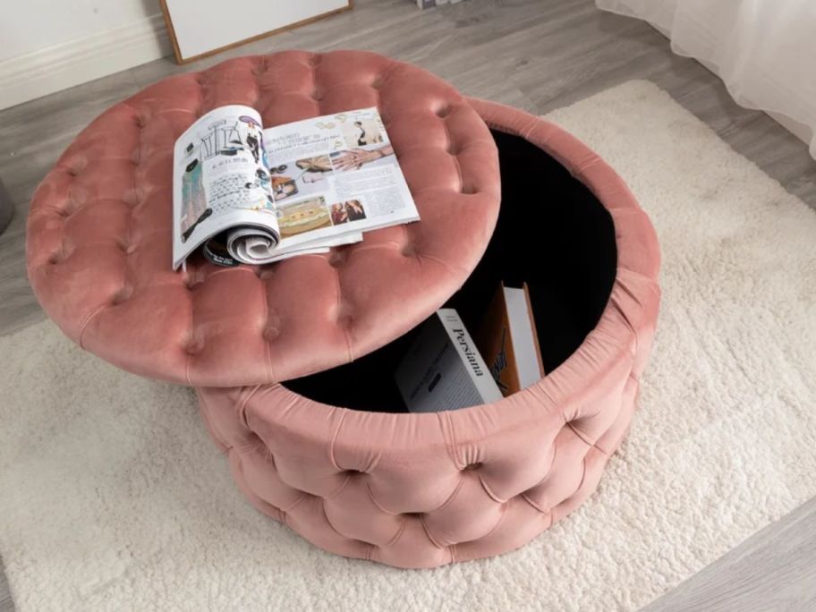 a large round tufted storage ottoman on a rug in a living room