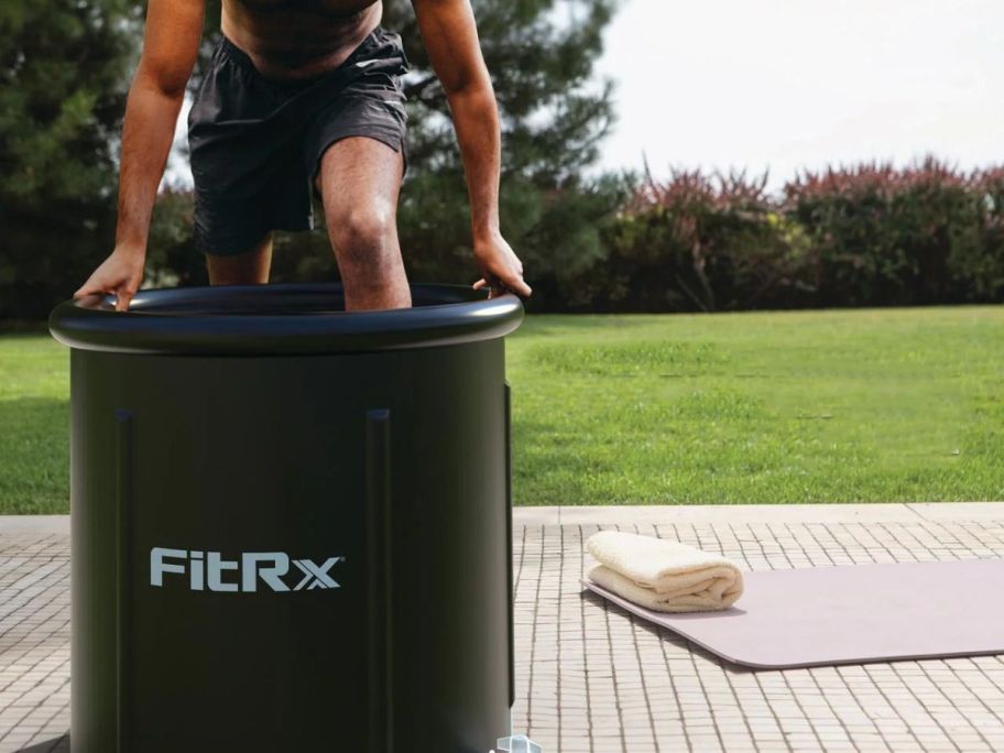 man getting in FitRx Ice Bath 