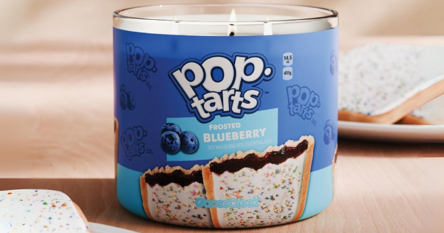 Blueberry Pop-Tart 3 wick candle with Pop-Tarts on plates to the side