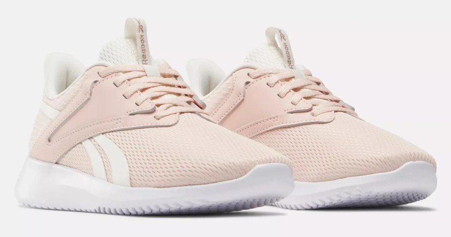 pair of light pink and white Reebok women's athletic sneakers