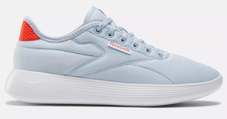 women's Reebok casual sneaker in light blue and white with orange accents