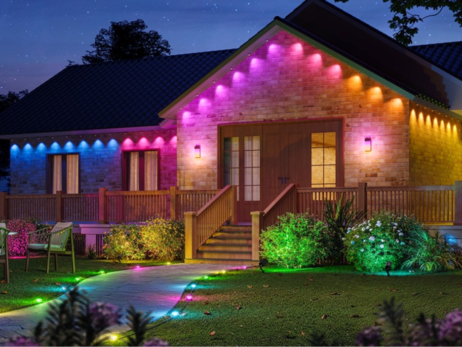 outside of a house with colorful lighting around the roofline